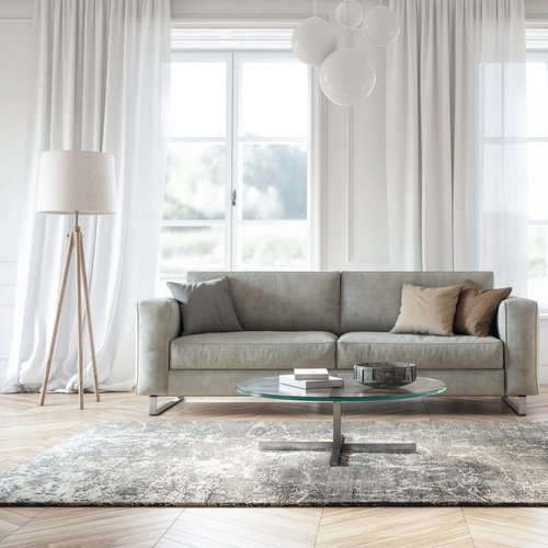 sofa and a white floor lamp in bright living room from Northcraft Flooring & Design in Raytown, MO