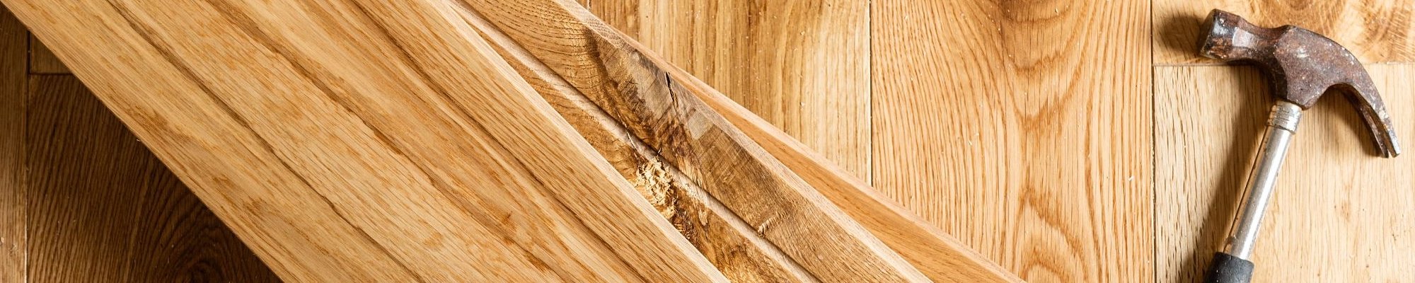 installation hammer on hardwood planks from Northcraft Flooring & Design in Lee's Summit, MO