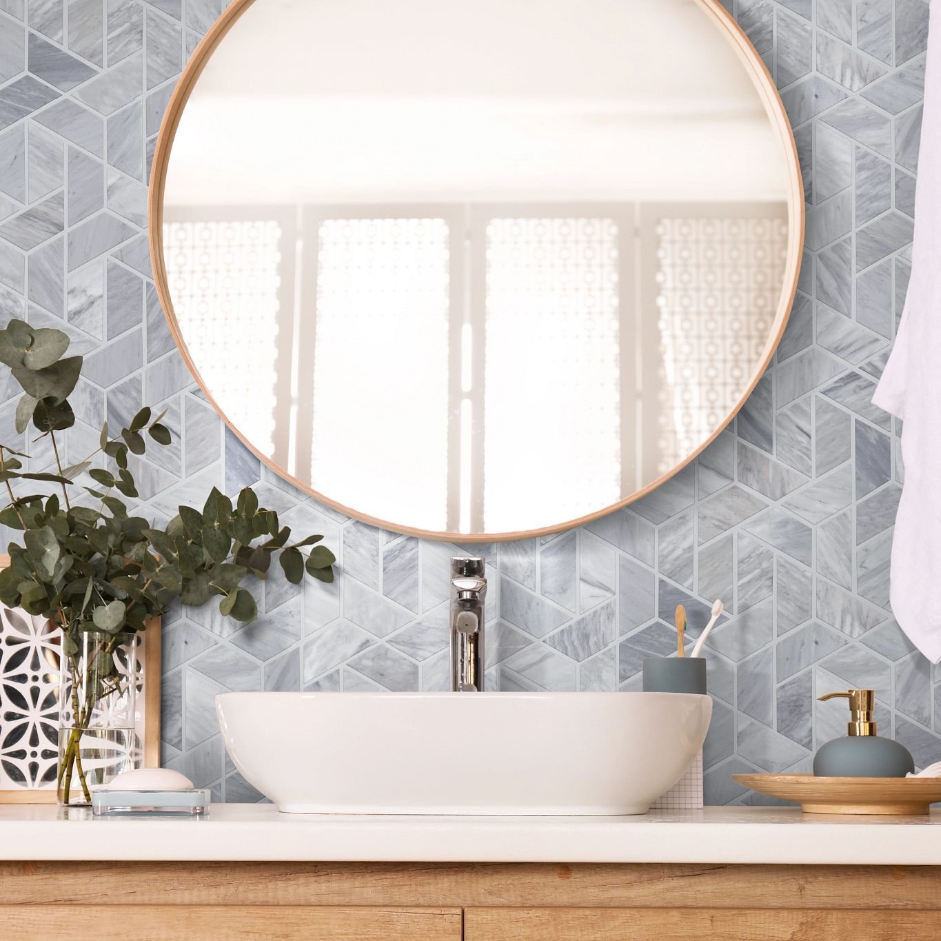 bathroom sink and a mirror from Northcraft Flooring & Design in Raytown, MO