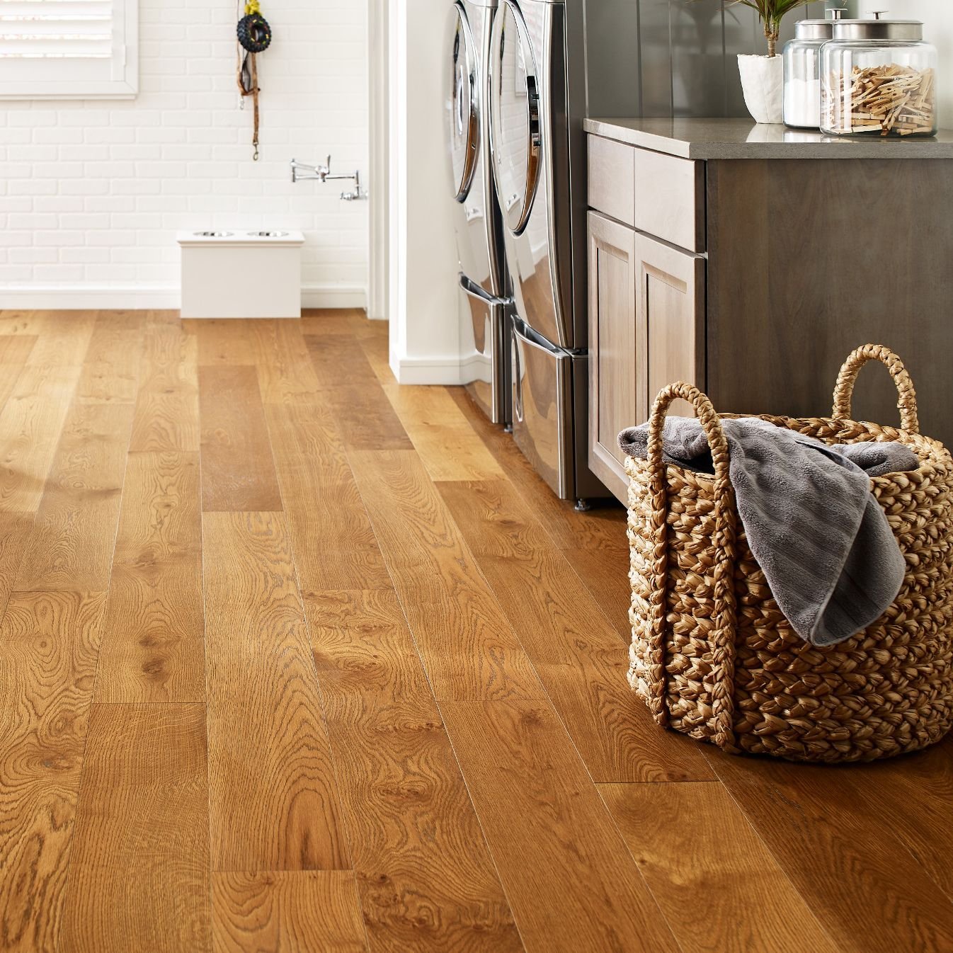 Laundry room with wood-look luxury vinyl flooring from Northcraft Flooring & Design in Raytown, MO