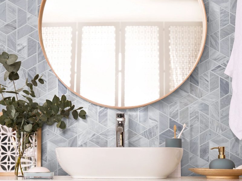bathroom sink and a mirror from Northcraft Flooring & Design in Lee's Summit, MO