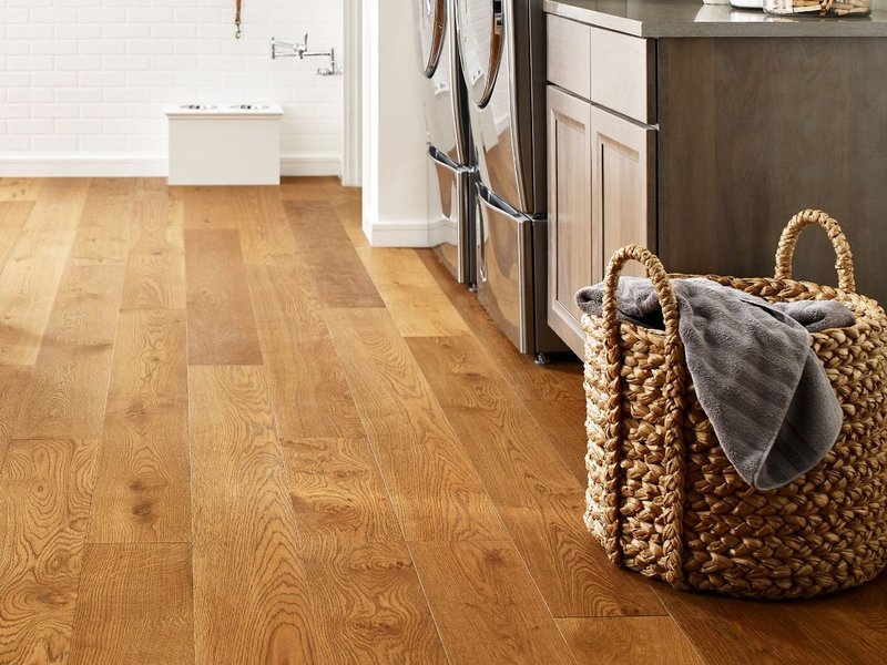 Laundry room with wood-look luxury vinyl flooring from Northcraft Flooring & Design in Raytown, MO